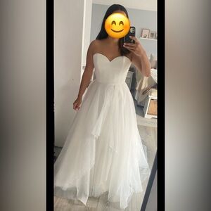 Wedding Dress
Purchased, altered, but never worn